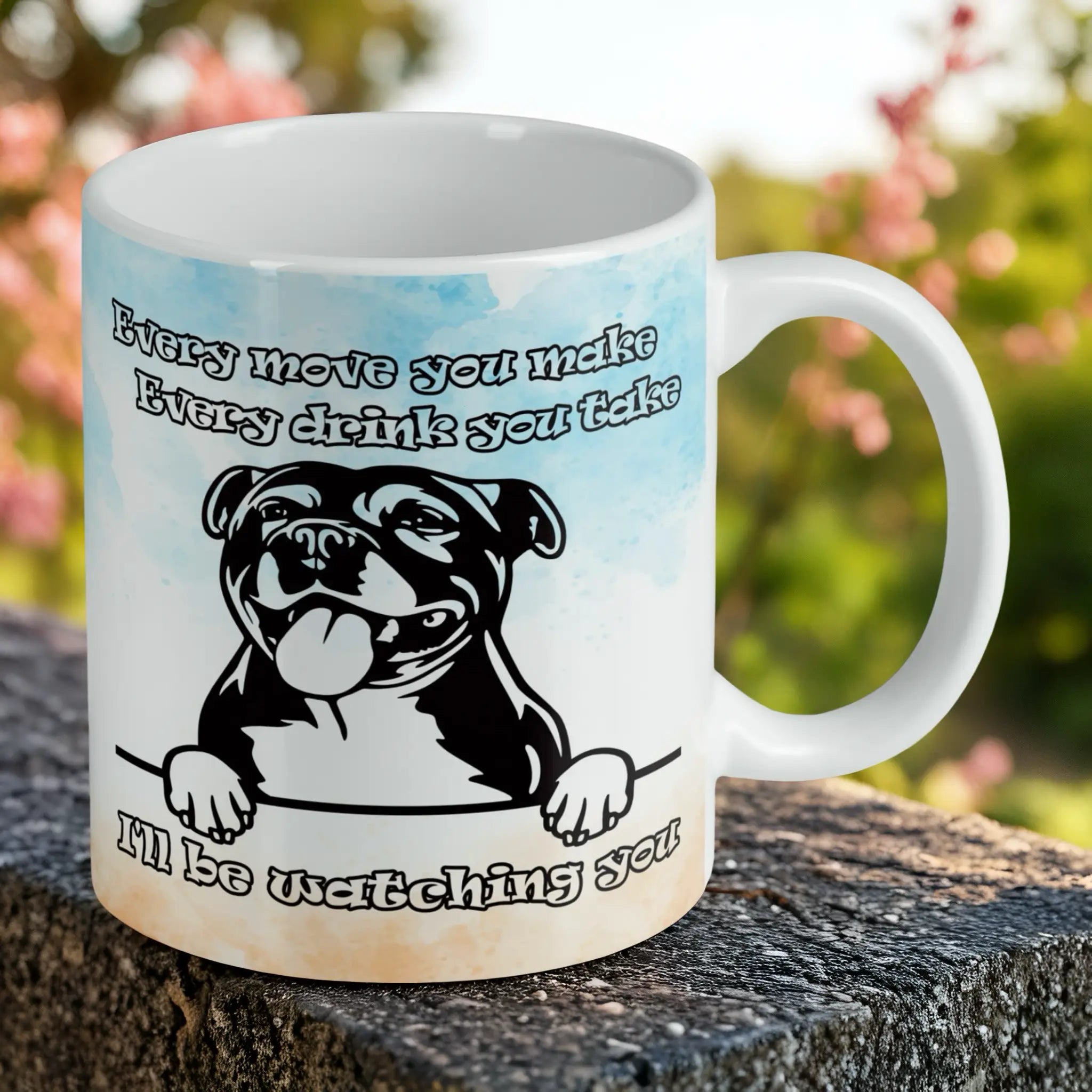 Reverse side of Cheeky Staffy "I'll Be Watching You" mug, showing a Staffy face and text about watching you, by Laser Design Creations.