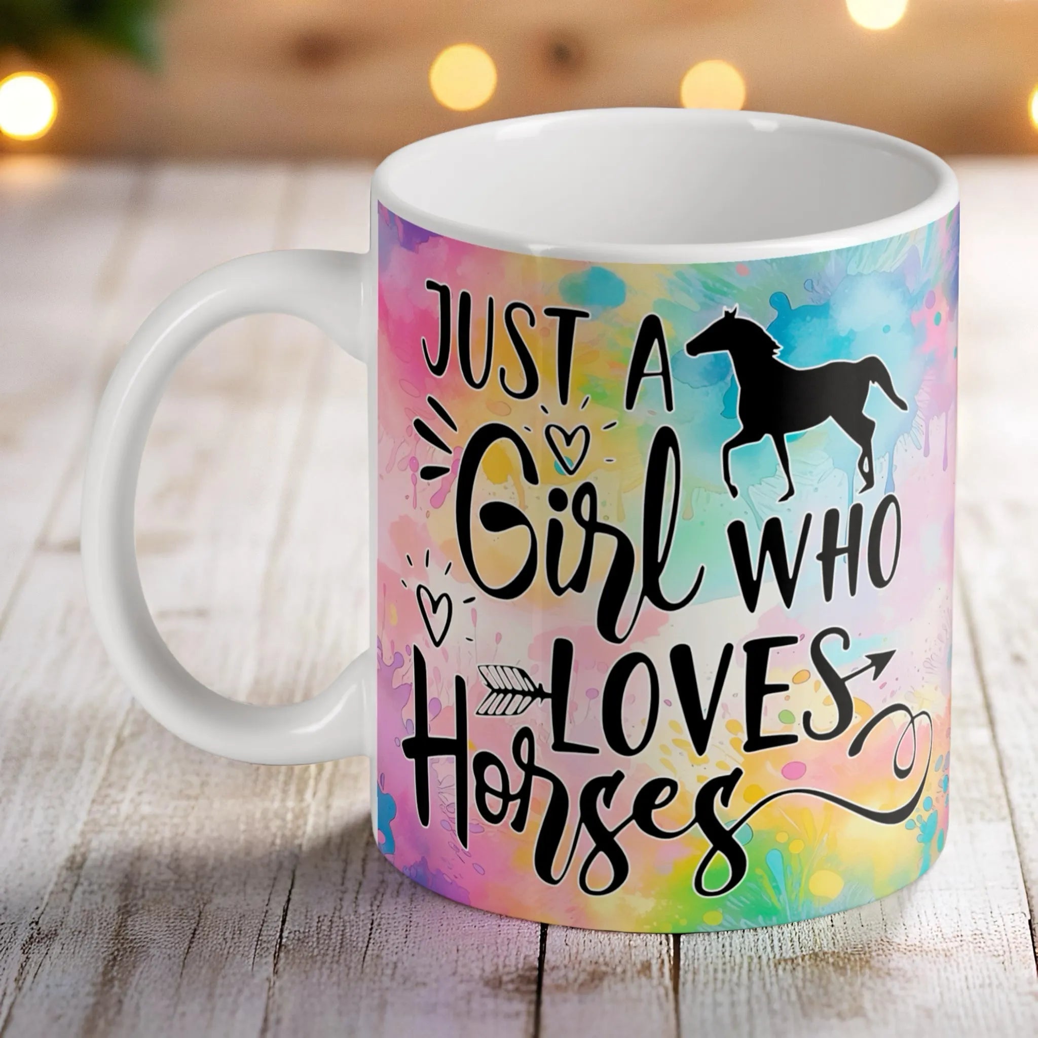 Colourful watercolour splash mug by Laser Design Creations, featuring a "Just a Girl Who Loves Horses" design with a horse silhouette.
