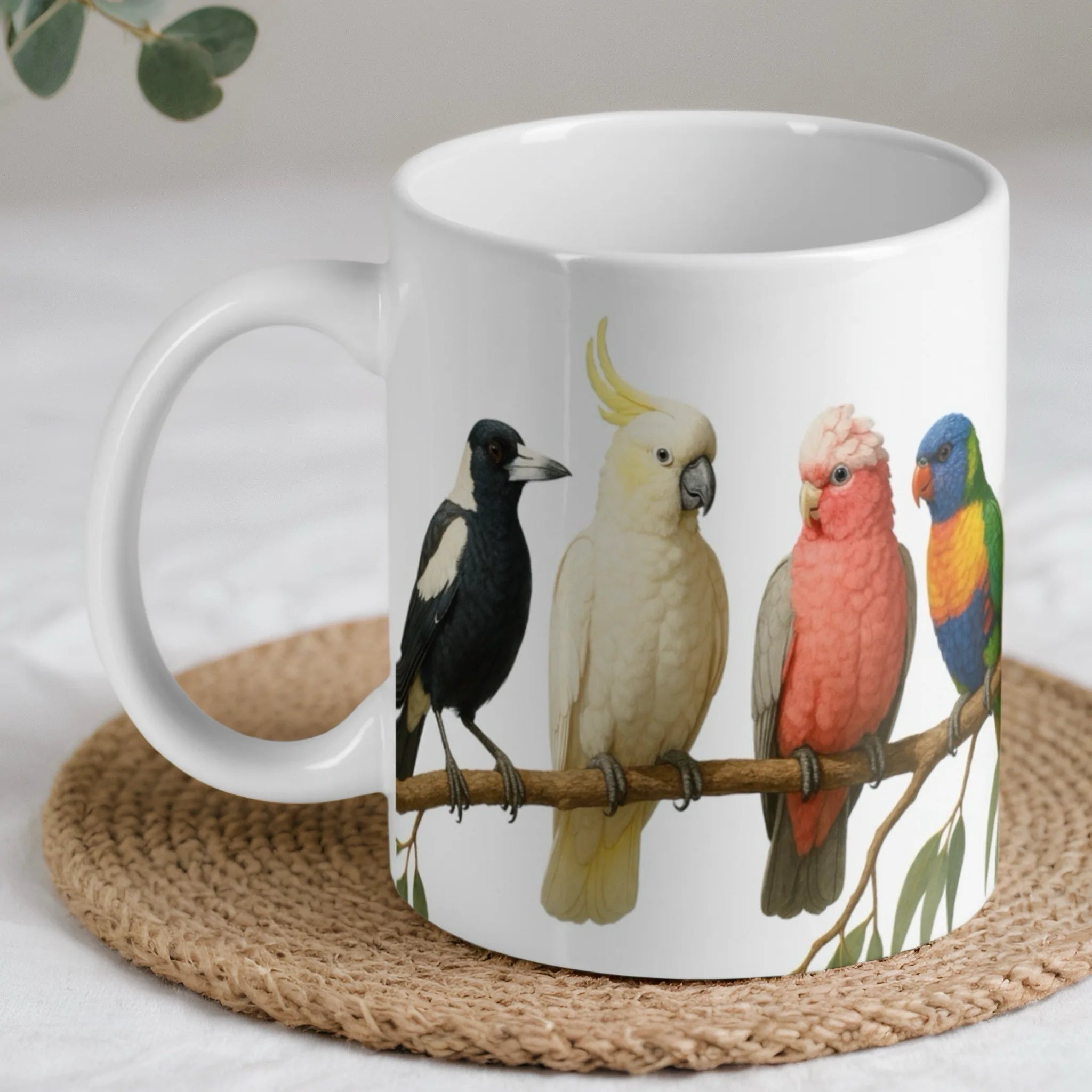 Colourful bird lineup ceramic mug by Laser Design Creations, featuring four native Australian birds on a gum branch.