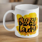 Crazy Dog Lady watercolour ceramic mug by Laser Design Creations, featuring a yellow watercolour splash and black paw print text.