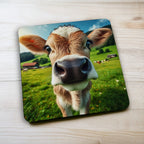 Side view of a set of four Curious Country Calf coasters, a perfect gift for lovers of farmhouse decor by Laser Design Creations.