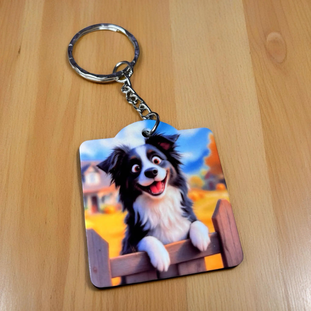 Cute Border Collie Picket Fence Keyring, showcasing a cheerful cartoon border collie next to a white picket fence by Laser Design Creations.