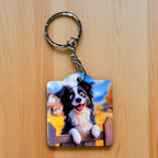 Happy Border Collie Picket Fence Cartoon keyring by Laser Design Creations, featuring an expressive, cute border collie standing in front of a white picket fence.