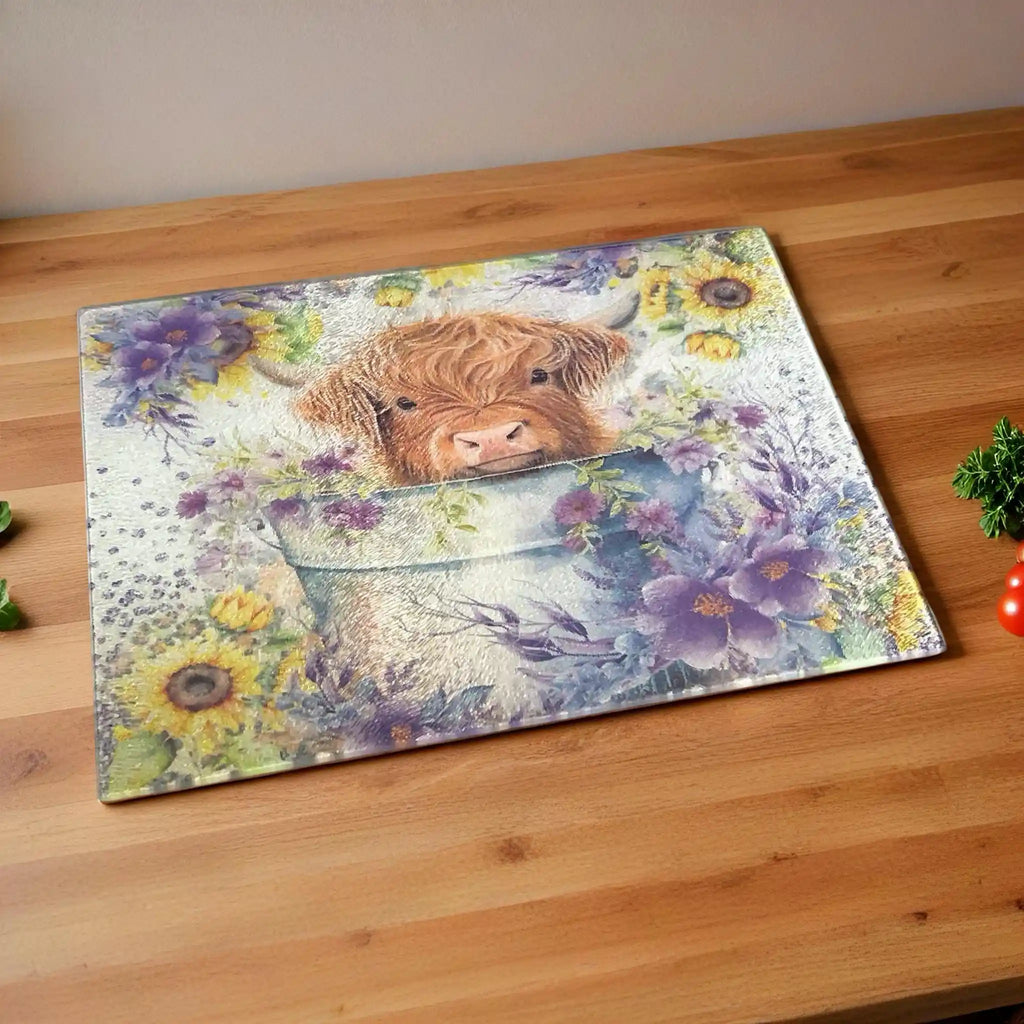 Cute Highland Calf in Bucket with Sunflowers chopping board by Laser Design Creations, featuring a fluffy baby Highland cow surrounded by vibrant sunflowers in a rustic, farmhouse style.