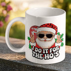 Funny Santa Disco Ball Ho's Quote ceramic mug by Laser Design Creations, featuring a crude humour Santa holding a disco ball and the text "I DO IT FOR THE HO'S".