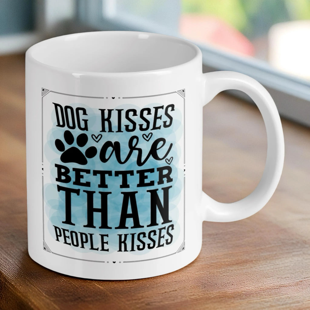 Reverse side of 'Dog Kisses are Better' quote ceramic mug, showcasing the humorous typography with a paw print accent and watercolour background by Laser Design Creations.