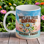 Don't Let Their Energy Change Yours Retro Daisy ceramic mug by Laser Design Creations, featuring an uplifting retro cartoon daisy design with the quote 'Don't Let Their Energy Change Yours'.
