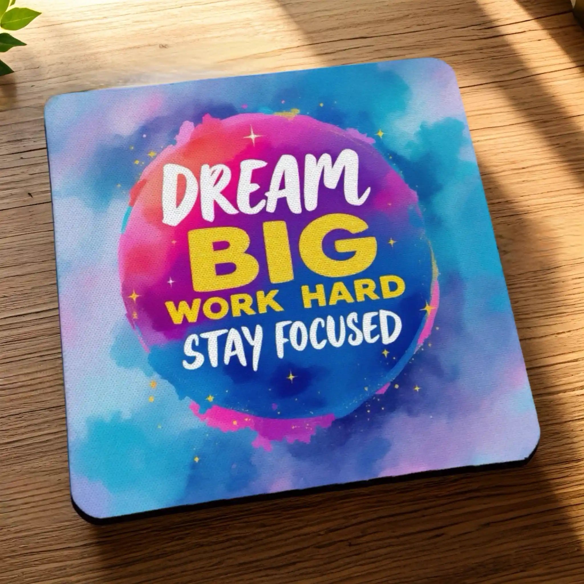 Side view of Dream Big Work Hard neoprene coasters, showcasing motivational quotes on a vibrant, colourful watercolour galaxy background by Laser Design Creations.