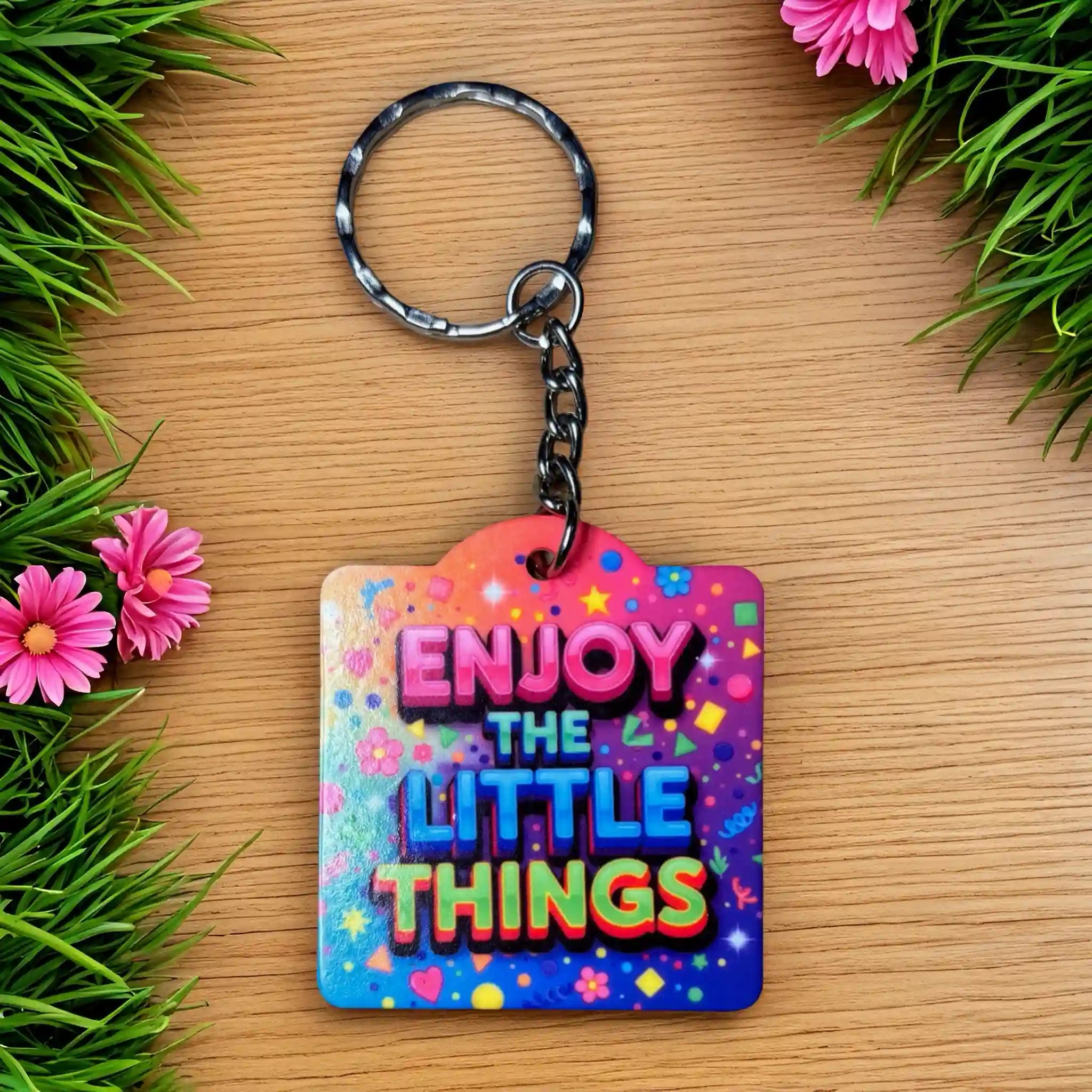 Enjoy The Little Things Keyring - Funky Rainbow Confetti Design acrylic keyring by Laser Design Creations, featuring the motivational quote ENJOY THE LITTLE THINGS surrounded by a funky rainbow pattern.