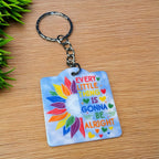 Side view of Inspirational Quote Rainbow Sunflower Keyring, showcasing a cheerful rainbow background and motivational text by Laser Design Creations.