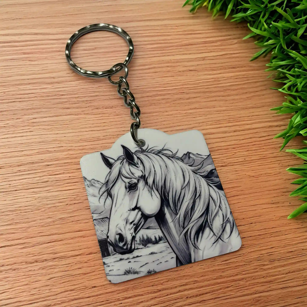 Side view of Flowing Mane Majestic Horse keyring, showcasing a rustic ink sketch of a wild stallion with a detailed illustration of a flowing mane against a neutral background by Laser Design Creations.