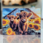 A vibrant farmhouse-style design featuring two fluffy Highland calves standing in a sunny sunflower field chopping board from Laser Design Creations