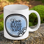 Reverse side of Love Is A Four Legged Word Quote ceramic mug, showcasing a charming watercolour design with a paw print graphic by Laser Design Creations.