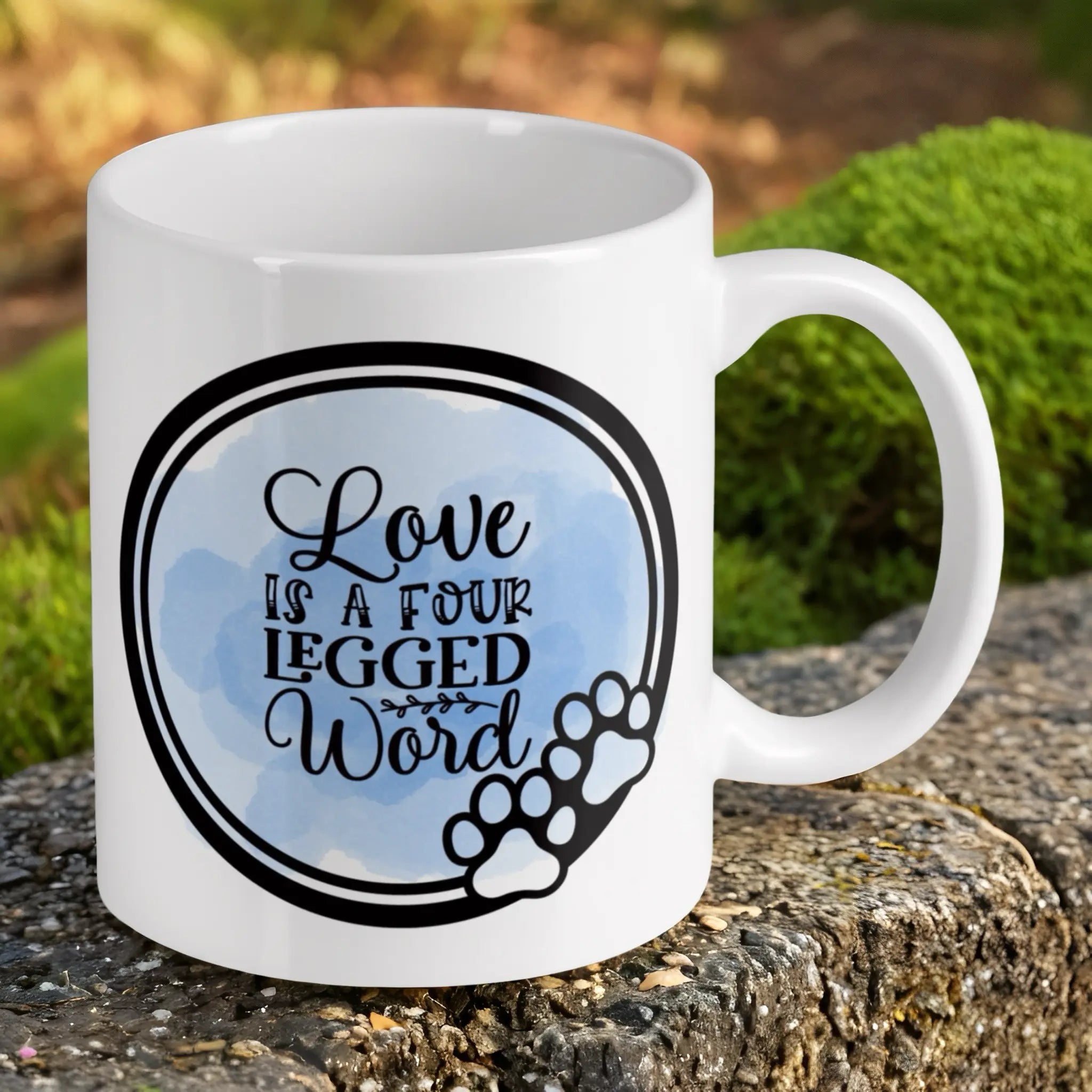 Reverse side of Love Is A Four Legged Word Quote ceramic mug, showcasing a charming watercolour design with a paw print graphic by Laser Design Creations.