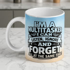 Funny Multitasker ceramic mug by Laser Design Creations, featuring bold typographic quote about listening, ignoring, and forgetting.