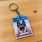 Side view of Every Breath You Take German Shepherd keyring, showcasing a humorous watercolour illustration of a German Shepherd watching intently against a plain background by Laser Design Creations.