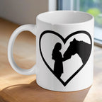 Girl and horse heart silhouette ceramic mug by Laser Design Creations, featuring a black silhouette of a girl and a horse inside a heart.