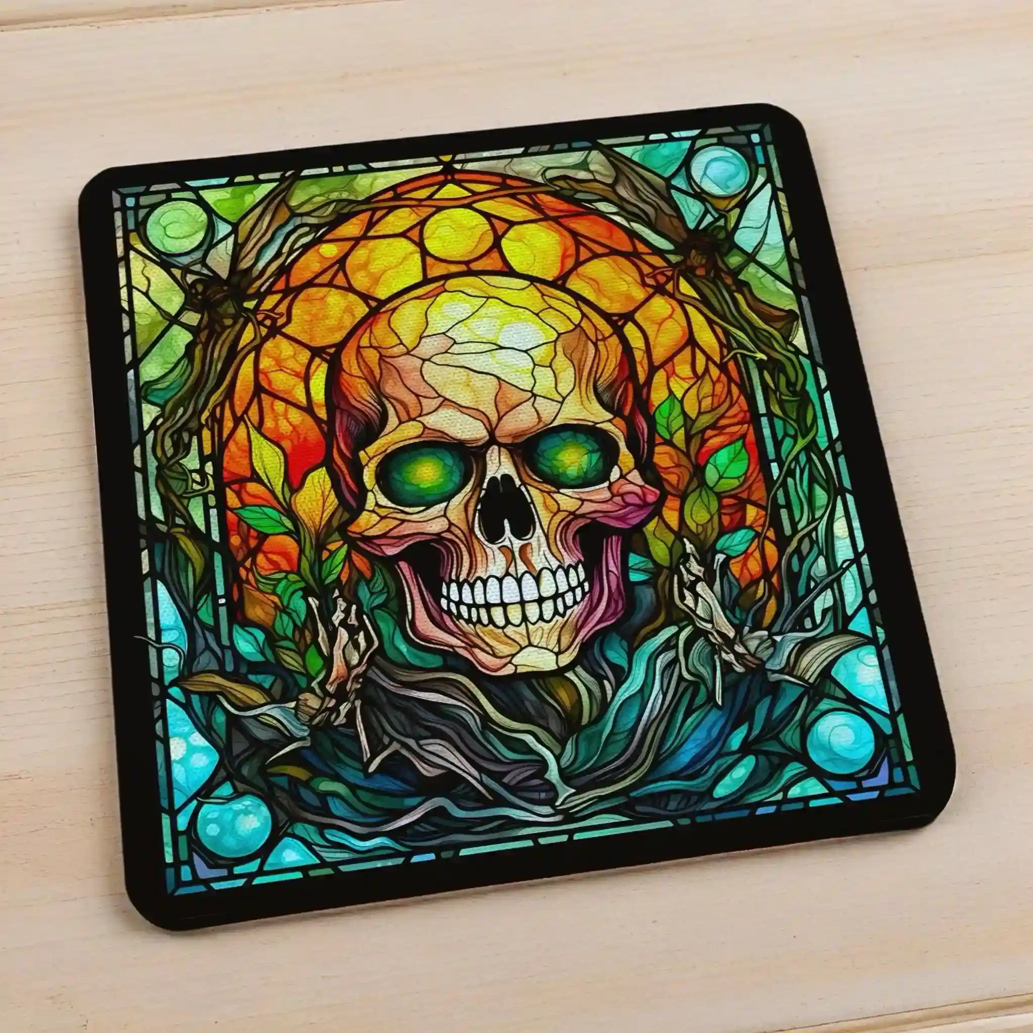 Side view of Gothic Stained Glass Skull style 1 neoprene coasters, showcasing distinct skull mosaic designs in vibrant dark fantasy colours with intricate leaded glass details by Laser Design Creations.