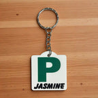 Front view of Personalised Green P Provisional Plate acrylic keyring, showcasing an iconic Australian driving plate design with custom name against a soft neutral background by Laser Design Creations.