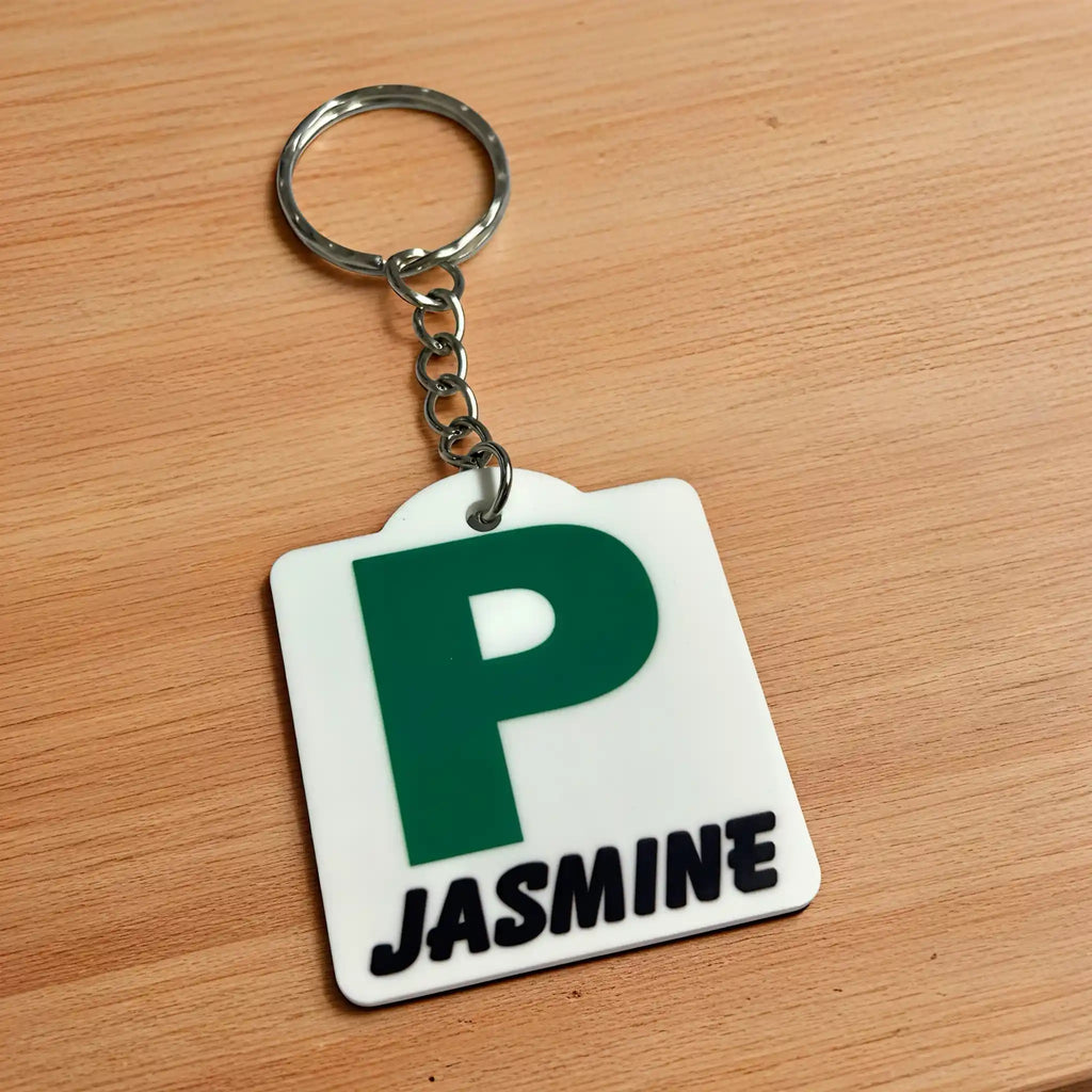 Side view of Personalised Green P Provisional Plate acrylic keyring, showcasing an iconic Australian driving plate design with custom name against a soft neutral background by Laser Design Creations.
