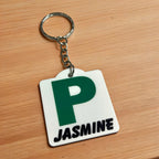 Side view of Personalised Green P Provisional Plate acrylic keyring, showcasing an iconic Australian driving plate design with custom name against a soft neutral background by Laser Design Creations.