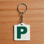 Front view of Personalised Green P Provisional Plate acrylic keyring, showcasing an iconic Australian driving plate design against a soft neutral background by Laser Design Creations.