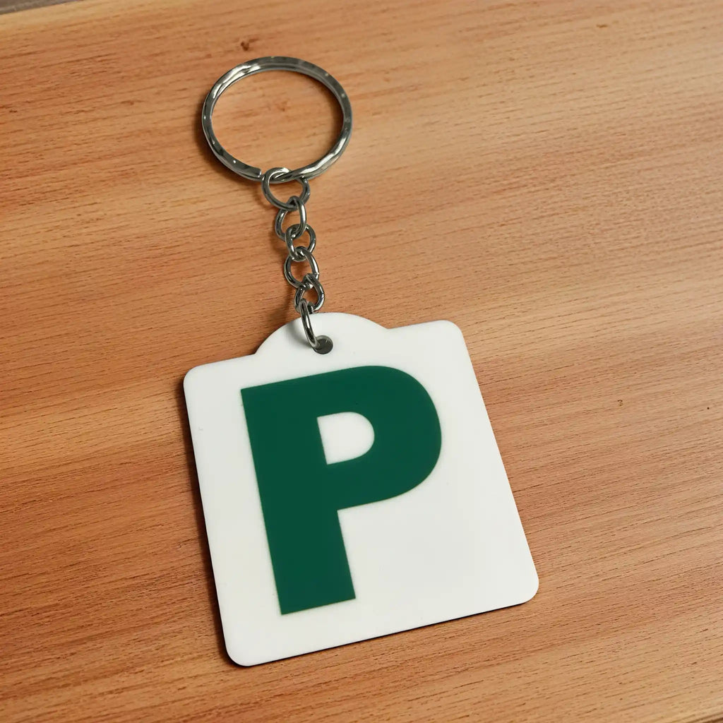 Side view of Personalised Green P Provisional Plate acrylic keyring, showcasing an iconic Australian driving plate design against a soft neutral background by Laser Design Creations.