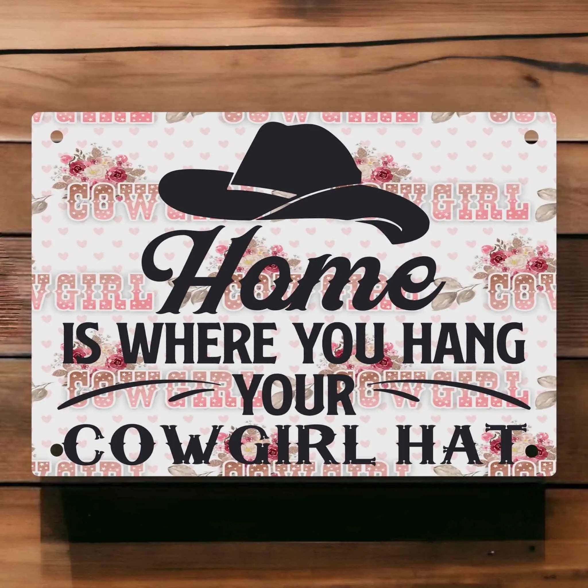 "Home is where you hang your cowgirl hat" Aluminium Sign by Laser Design Creations, featuring a feminine western design with floral accents.