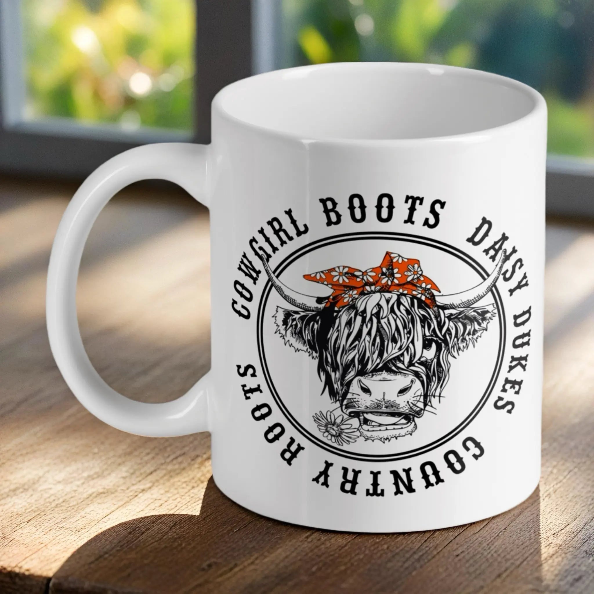 Country Roots Highland Cow ceramic mug by Laser Design Creations, featuring a cheeky cow with a bandana and daisy.