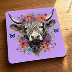 Side view of Highland Cow Flower Crown Purple neoprene coasters, showcasing a whimsical highland cow wearing a colourful purple floral crown against a soft, artistic background by Laser Design Creations.