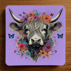 Highland Cow Flower Crown Purple neoprene coasters by Laser Design Creations, featuring a cute highland cow with a vibrant purple floral headpiece.