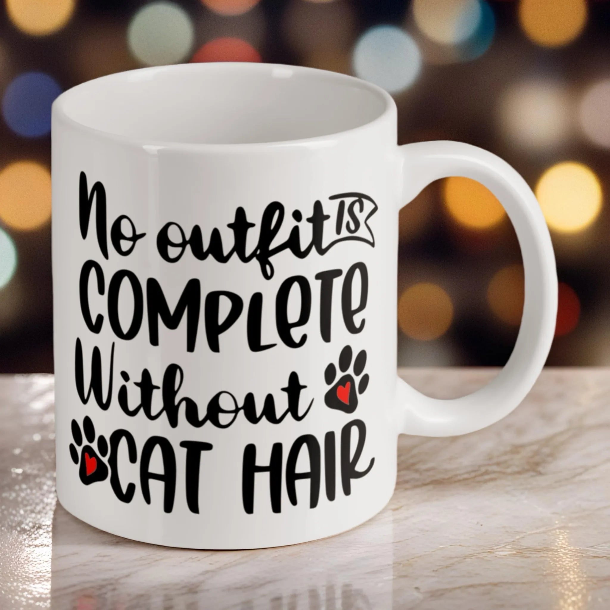 Reverse side of the "No Outfit is Complete Without Cat Hair" ceramic mug, showcasing the wrap-around artwork by Laser Design Creations.
