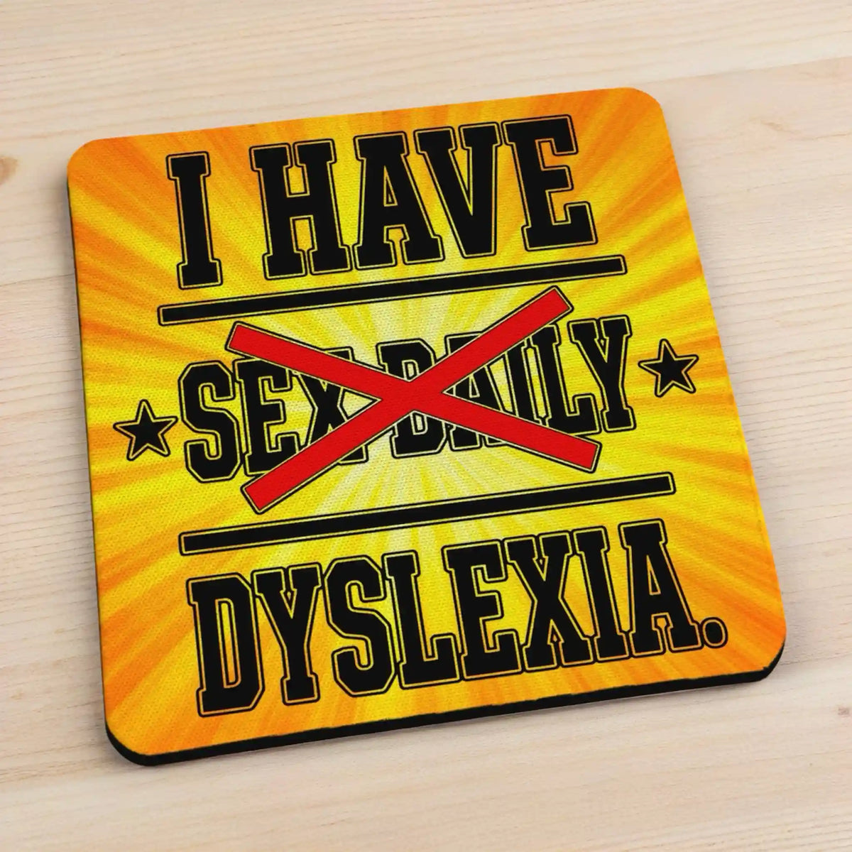 Side view of I Have Sex Daily Dyslexia neoprene coaster with slim black base profile, by Laser Design Creations.