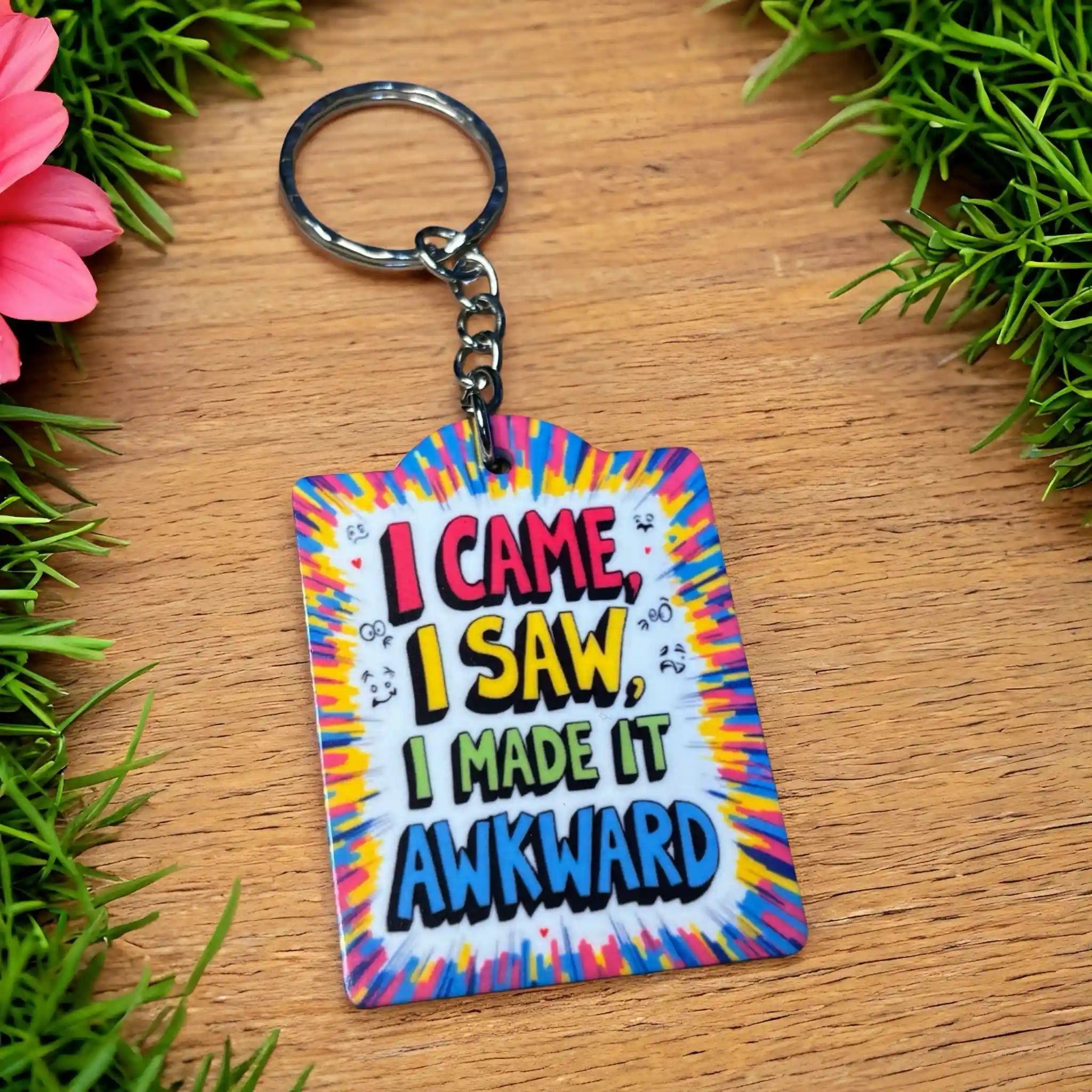 Side view of Funny Quote I Made It Awkward keyring, showcasing the maximalist vibrant style with the quote "I CAME, I SAW, I MADE IT AWKWARD" by Laser Design Creations.