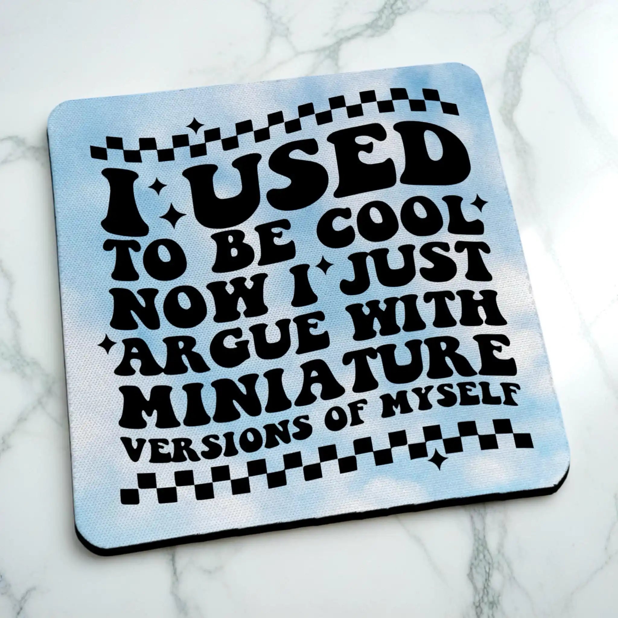 Side view of I Used To Be Cool neoprene coaster with a retro wavy design and blue clouds, by Laser Design Creations.