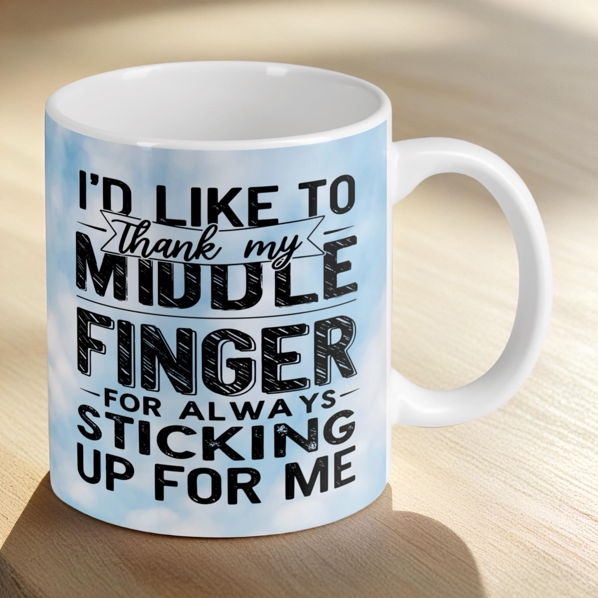 Reverse side of Thank My Middle Finger mug, depicting the humorous quote on a bright blue sky background by Laser Design Creations.