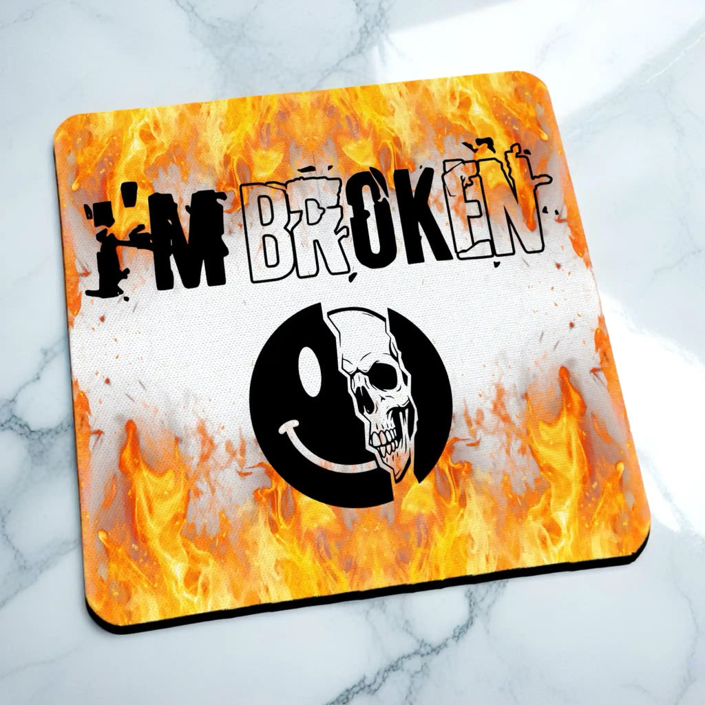 Side view of I'm Broken Skull Smiley neoprene coaster with a slim black profile and the alternative skull art on top, by Laser Design Creations.