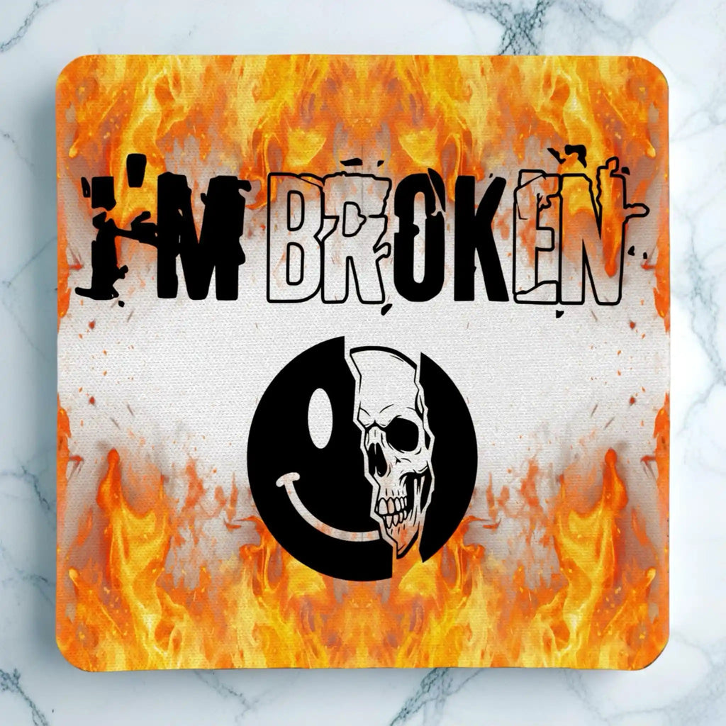 Top view of I'm Broken Skull Smiley neoprene coaster with the contrasting mental health dark humour graphic, by Laser Design Creations.