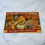 Funny vintage cooking quote chopping board by Laser Design Creations, featuring a retro pin-up style illustration and humorous typography.