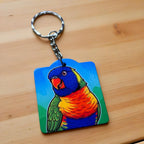 Side view of Illustrated Rainbow Lorikeet keyring, showcasing a colourful cartoon parrot with vibrant illustrative details by Laser Design Creations.