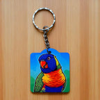 Illustrated Rainbow Lorikeet keyring by Laser Design Creations, featuring a vibrant, cartoon-style depiction of an Australian rainbow lorikeet.