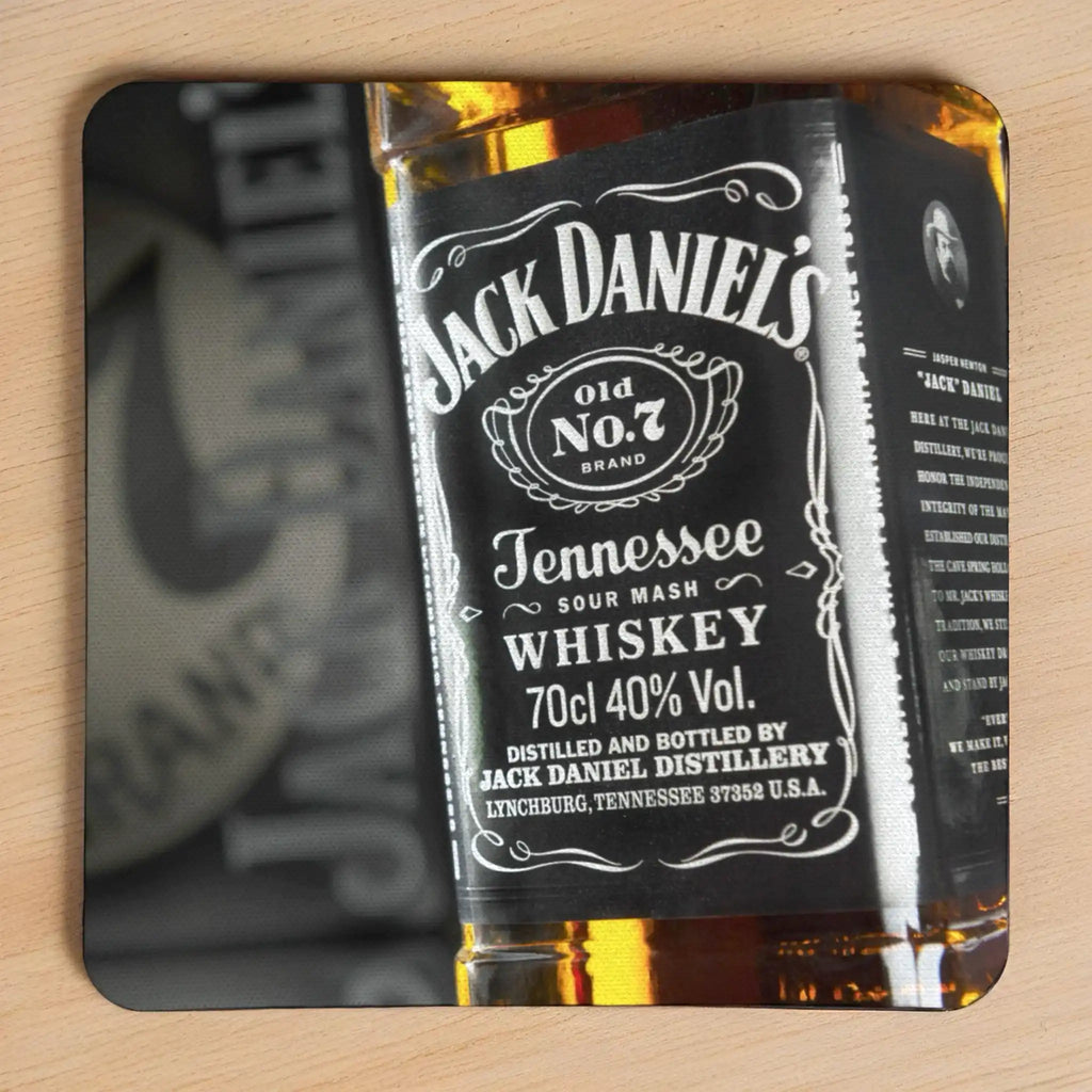 Jack Daniels Whiskey neoprene coasters by Laser Design Creations, featuring the iconic vintage black and white Jack Daniel's Tennessee Whiskey label with a rustic style suitable for a home bar.
