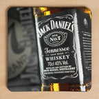 Jack Daniels Whiskey neoprene coasters by Laser Design Creations, featuring the iconic vintage black and white Jack Daniel's Tennessee Whiskey label with a rustic style suitable for a home bar.