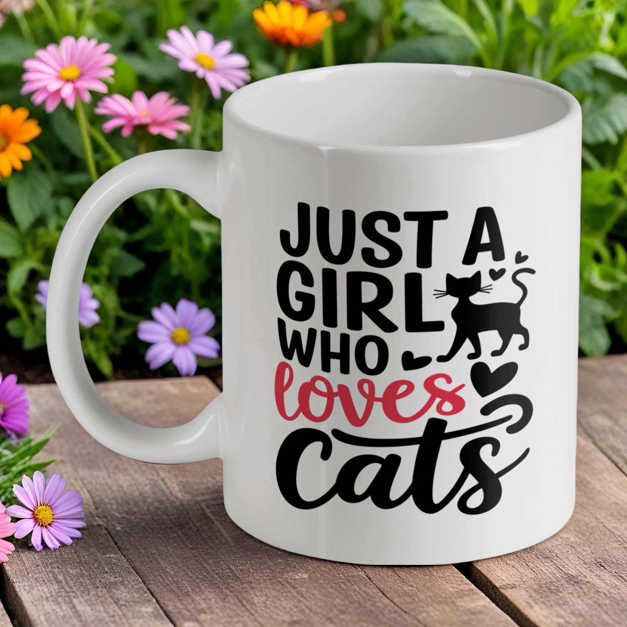 "Just a Girl Who Loves Cats" quote ceramic mug by Laser Design Creations, featuring clean typography.