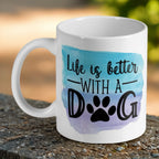 Life is better with a dog quote and watercolour paw print ceramic mug by Laser Design Creations, featuring the quote 'Life is better with a dog' in modern typography next to a colourful watercolour paw print on a white background.