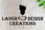 Laser Design Creations logo featuring a stylised laser head and heart on a light wood background with green leaves – Laser Design Creations.