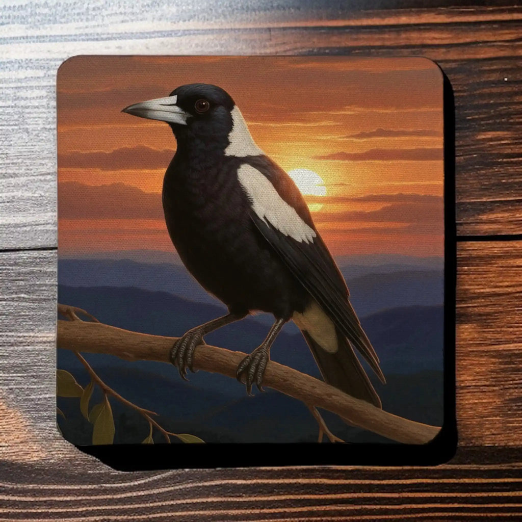 Top view of four neoprene coasters with a painterly design of an Australian Magpie at sunset, by Laser Design Creations.