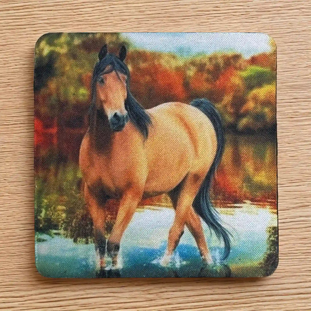 Top view of a set of four Wild Mustang neoprene coasters with a serene river and autumn colours, by Laser Design Creations.