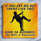 Top view of Mind Ya Business Wife is Expensive neoprene coaster with funny pole dancer silhouette and humorous text, by Laser Design Creations.
