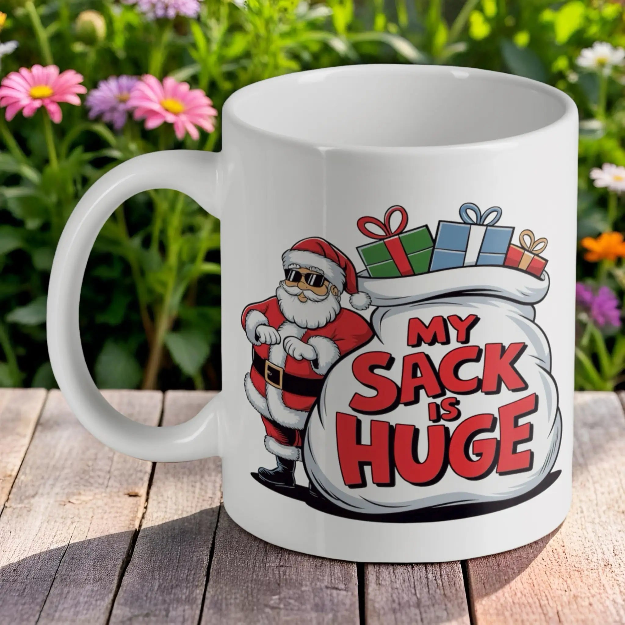Funny Santa My Sack Is Huge 11oz ceramic mug by Laser Design Creations, featuring a crude humour cartoon Santa holding a massive toy sack, clearly displaying the text "My Sack Is Huge".
